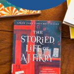 A copy of the book The Storied Life of AJ Fikry is on a table.