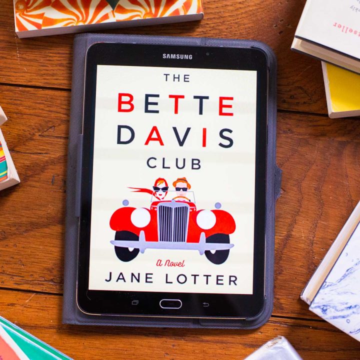 A digital reader has a copy of The Bette Davis Club book on the screen.