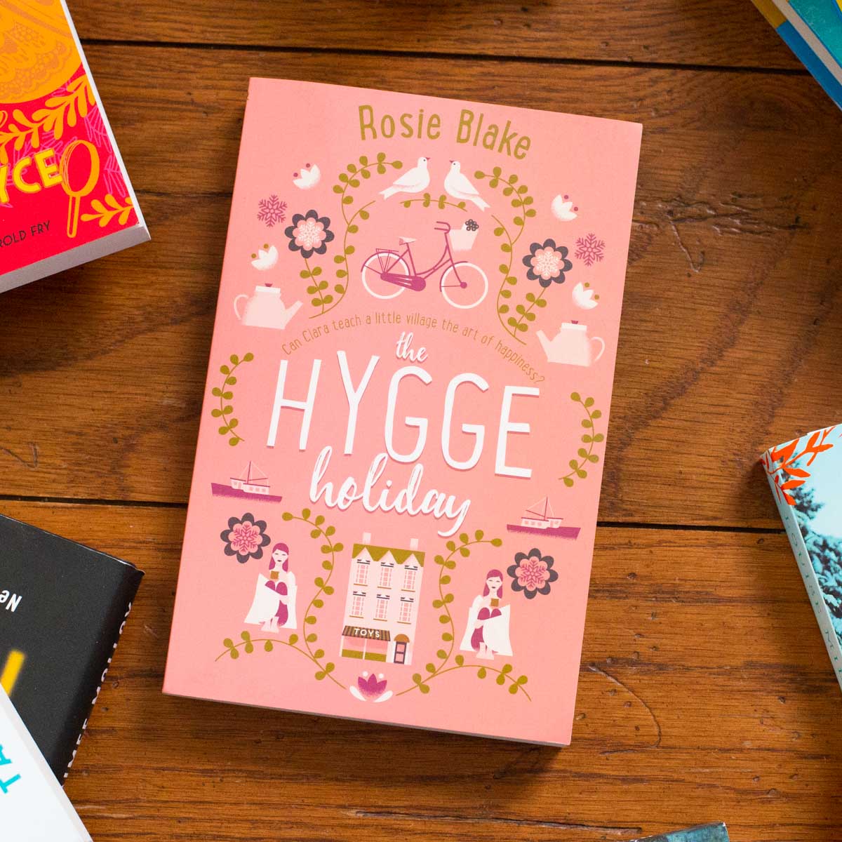 A copy of the book The Hygge Holiday sits on the table.