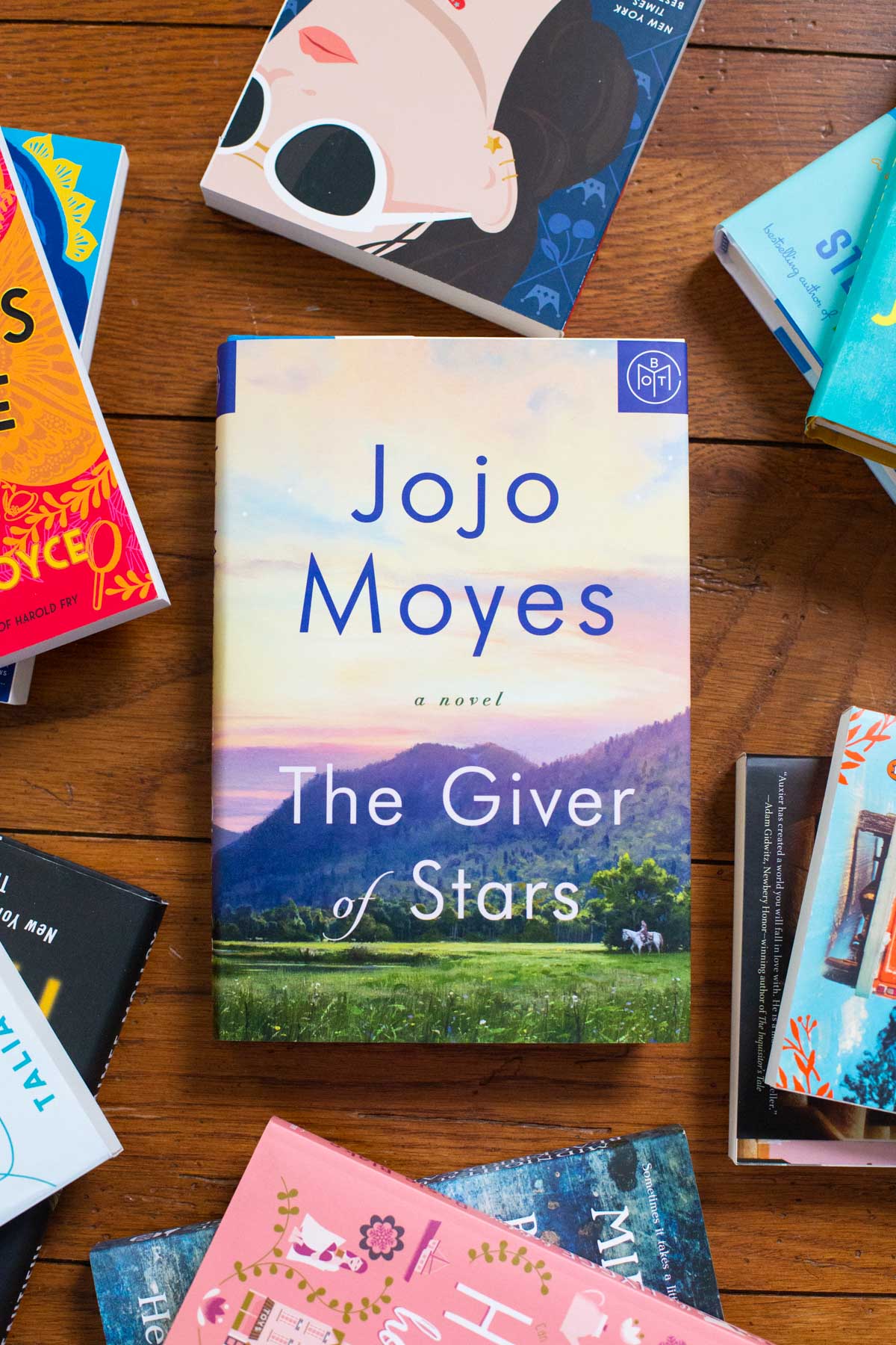 A copy of the book The GIver of Stars is on the table.