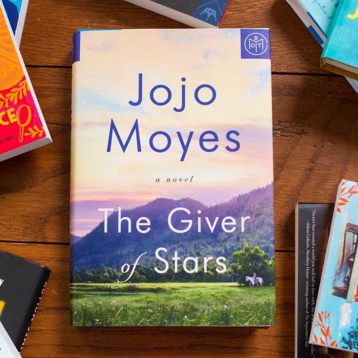 A copy of the book The GIver of Stars is on the table.