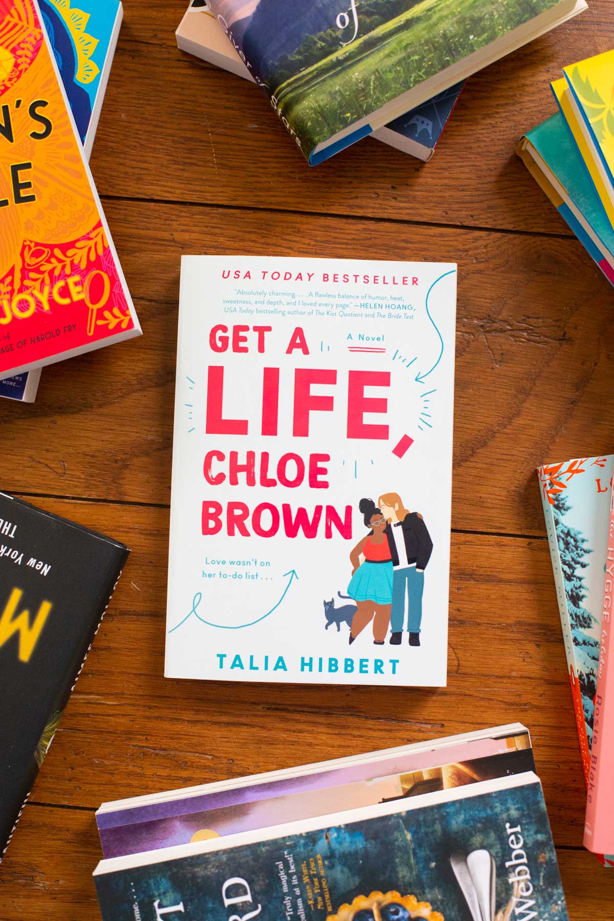 A copy of the book Get a Life Chloe Brown sits on a table.