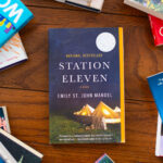 A copy of the book Station Eleven is on the table.