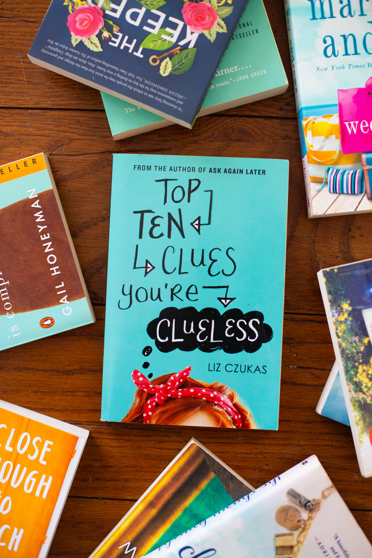 A copy of Top Ten Clues You're Clueless sits on a table.