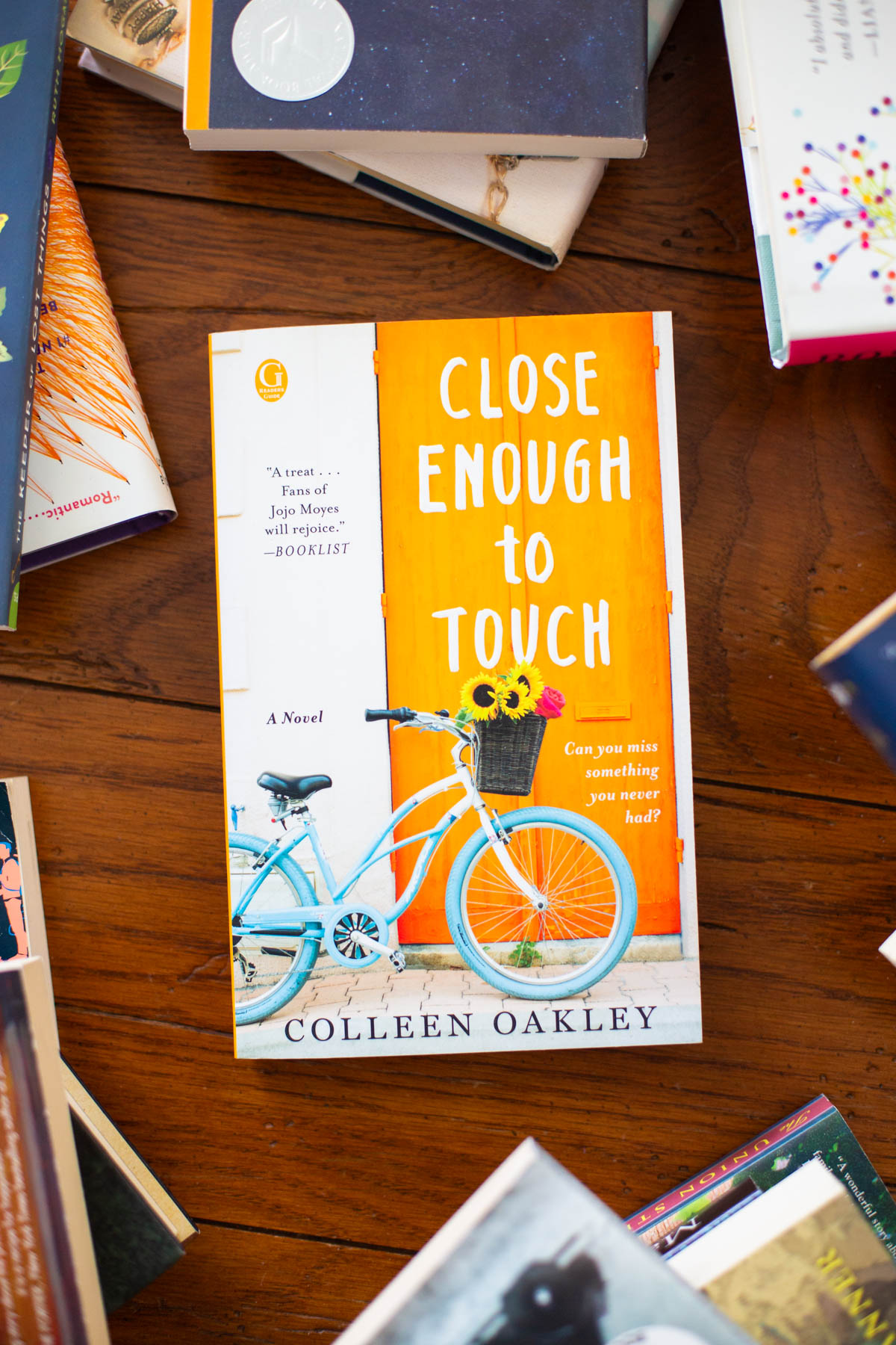 A copy of the book Close Enough to Touch is on the table.