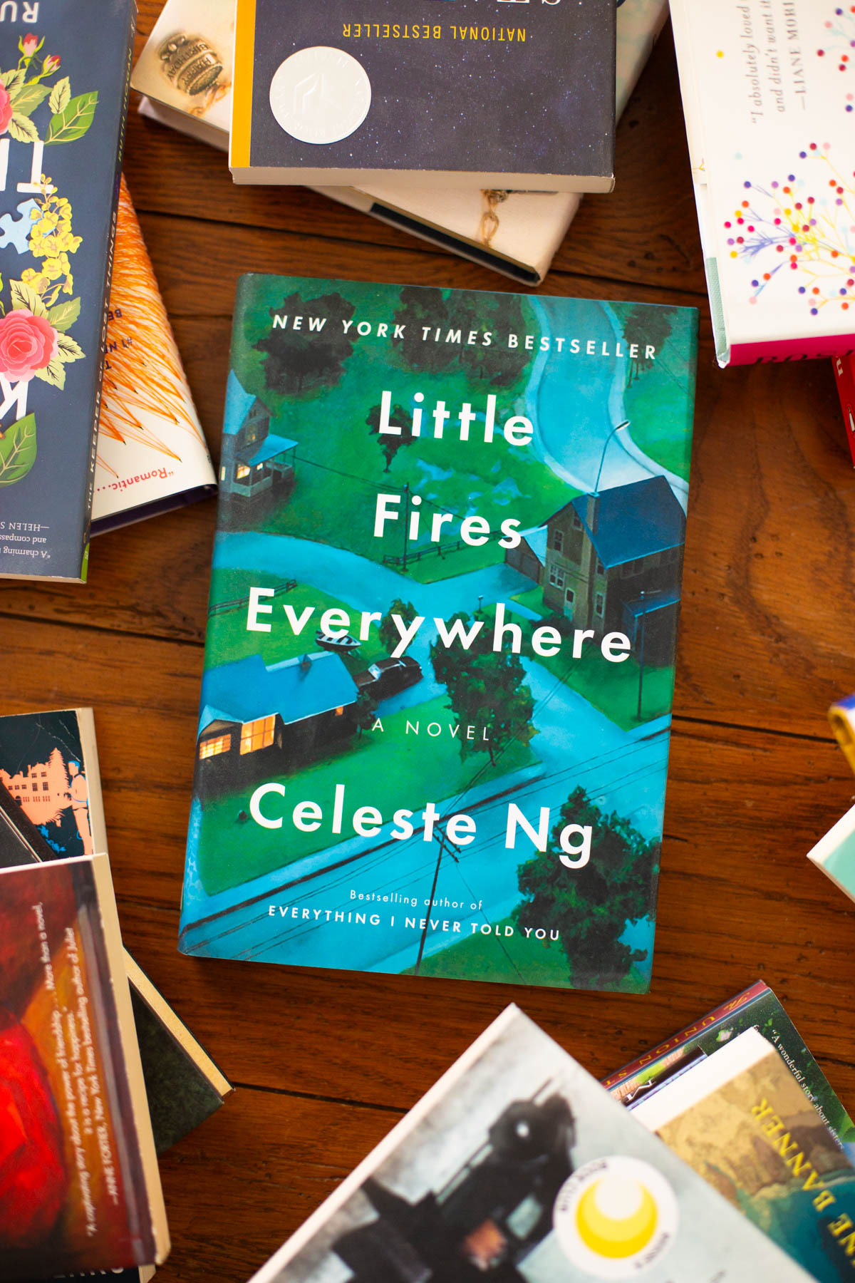 A copy of Little Fires Everywhere sits on the table.