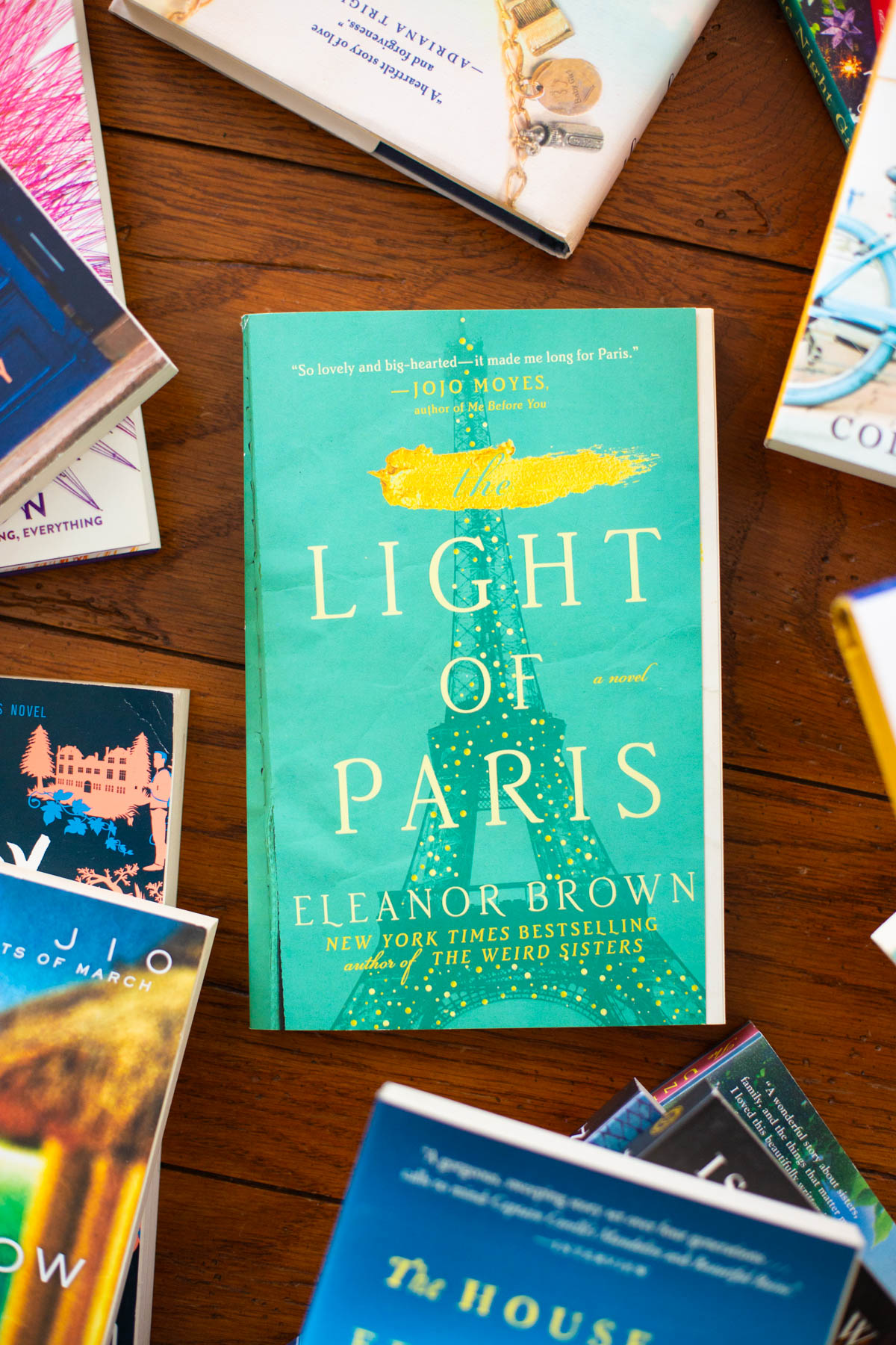 A copy of the book The Light of Paris sits on a table.