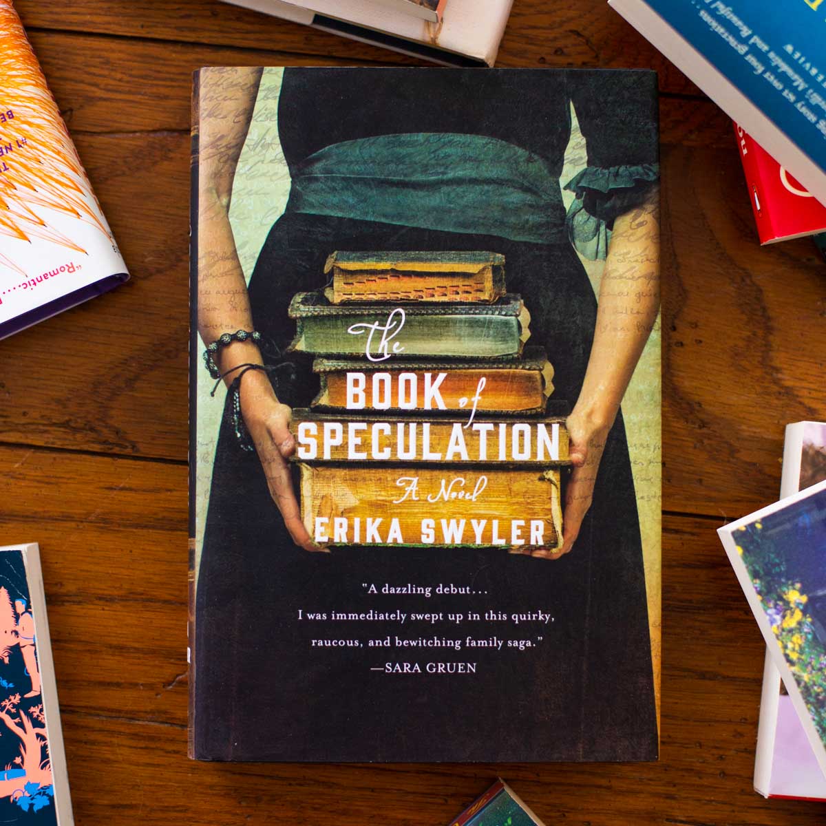A copy of the Book of Speculation is on a table.