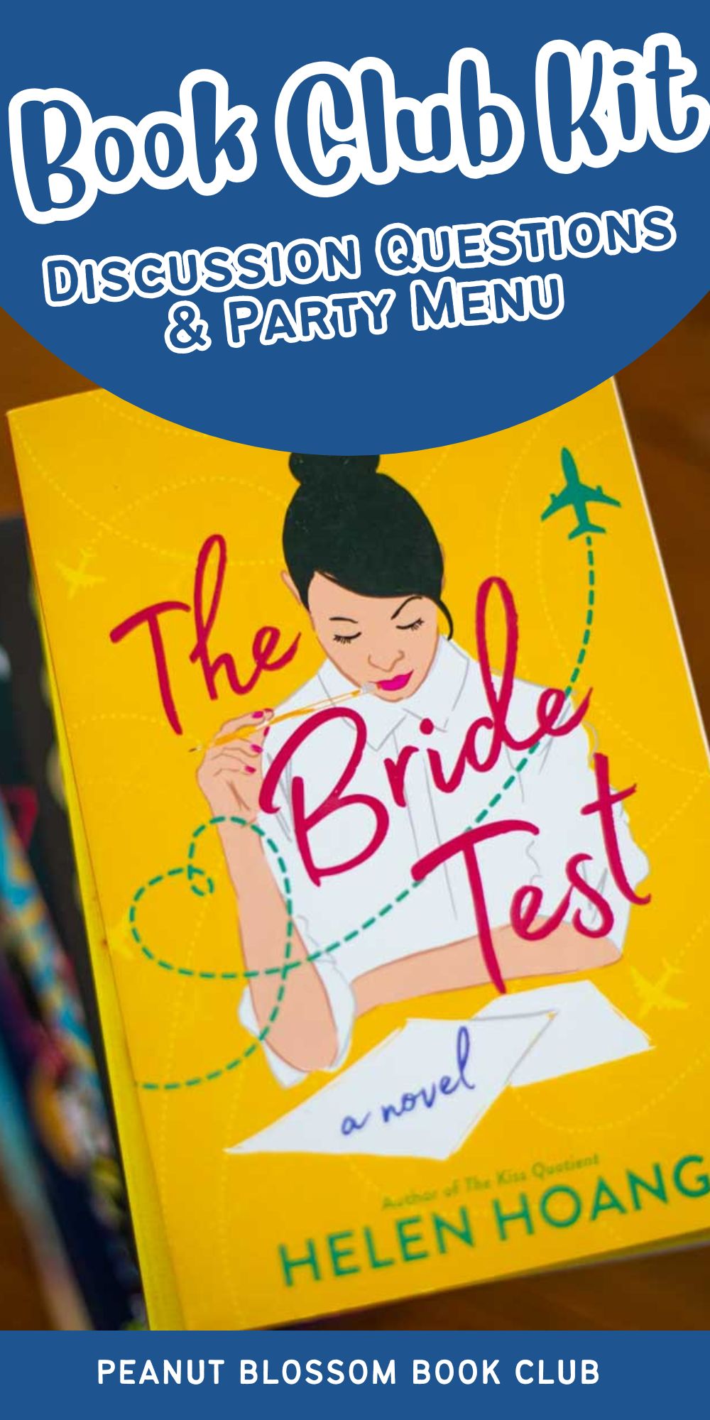 A copy of the book The Bride Test sits on a stack of books.