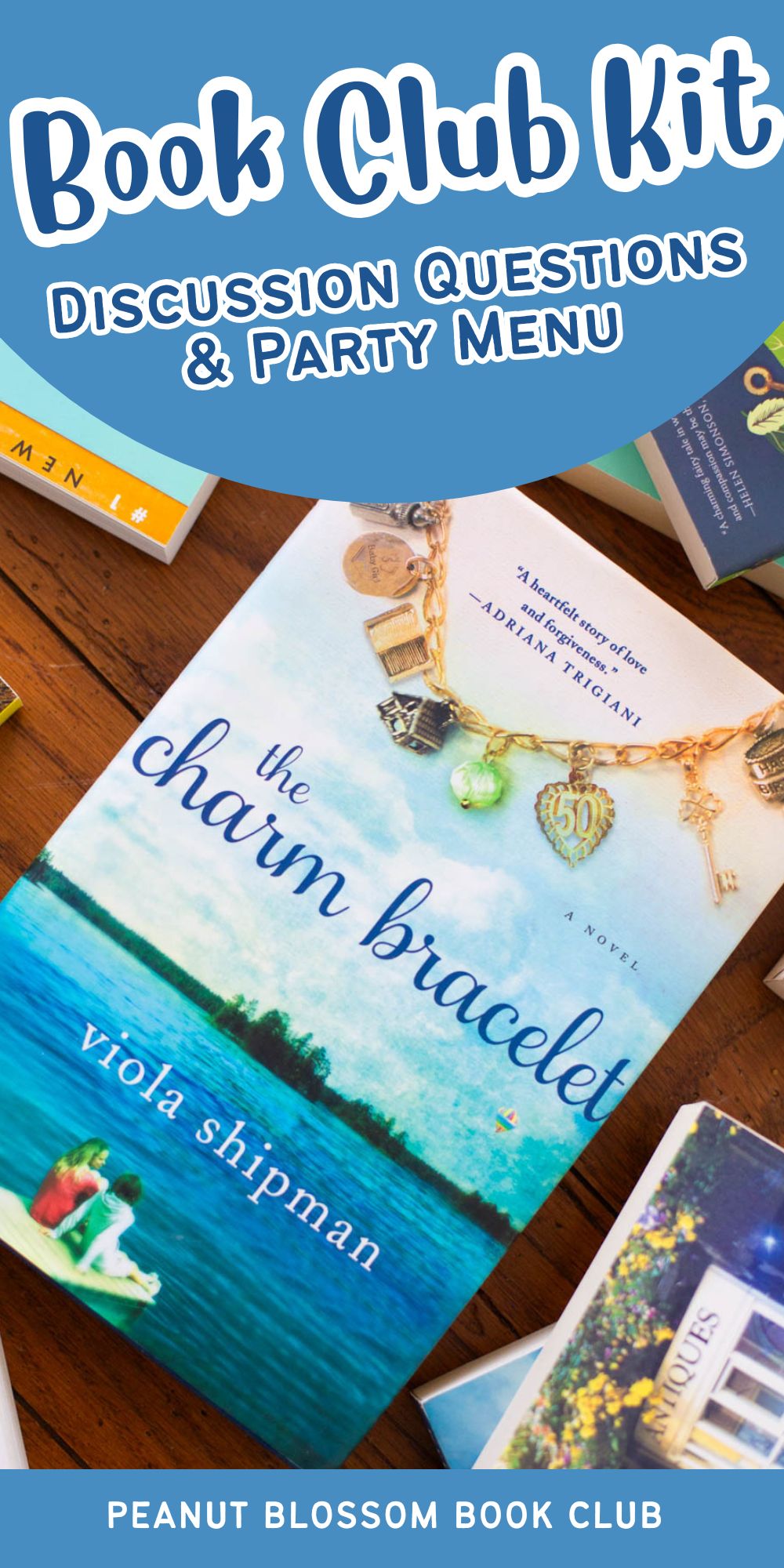 A copy of the book The Charm Bracelet is on the table.