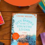 A copy of the book The City Baker's Guide to Country Living sits on the table.