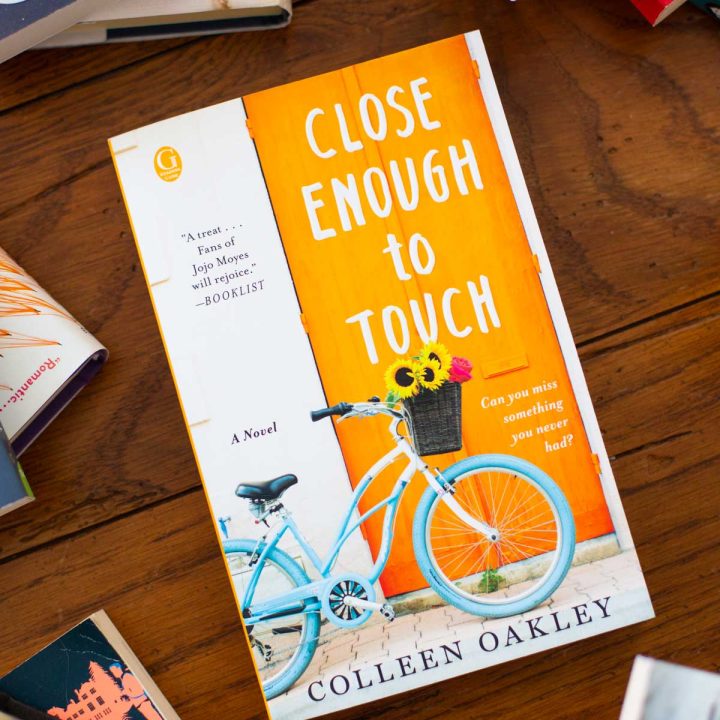 A copy of the book Close Enough to Touch is on the table.