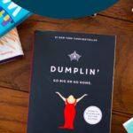 A copy of the book Dumplin sits on a table.