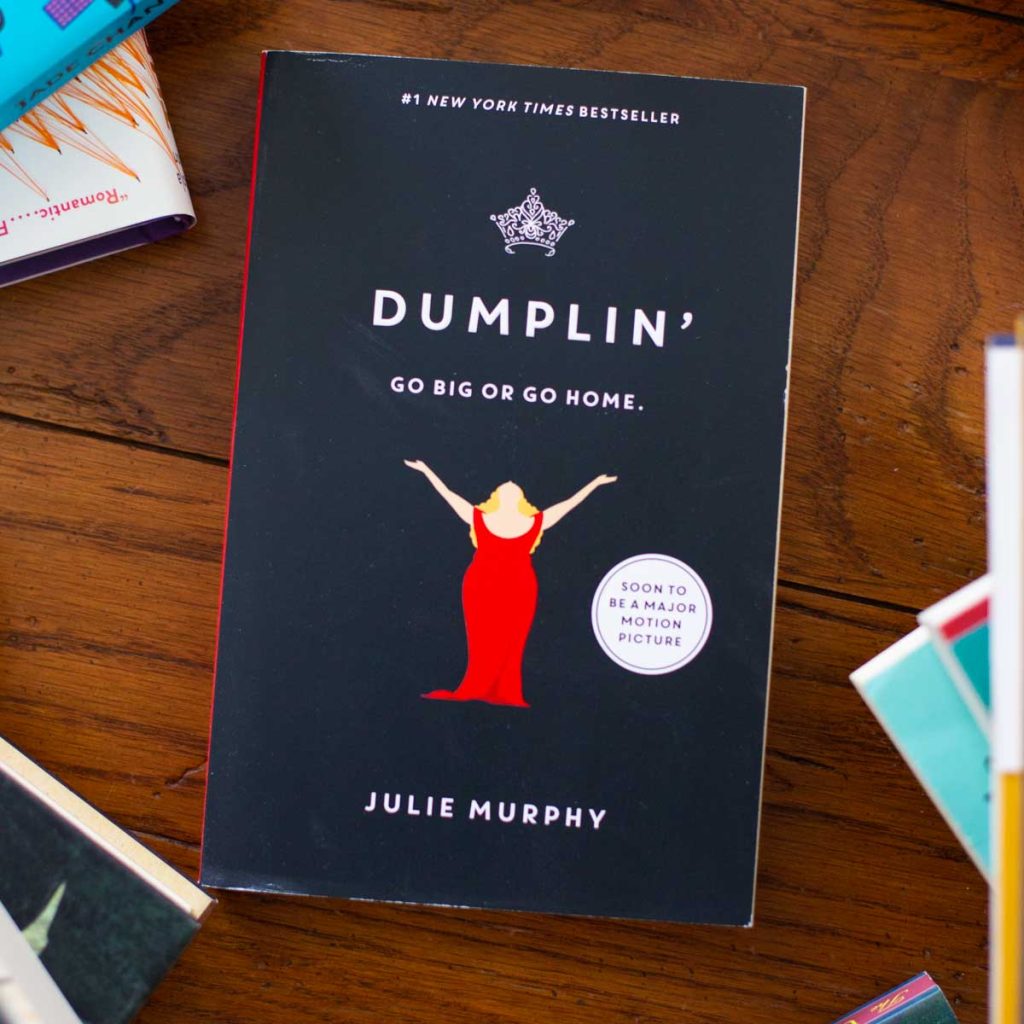 A copy of the book Dumplin sits on a table.