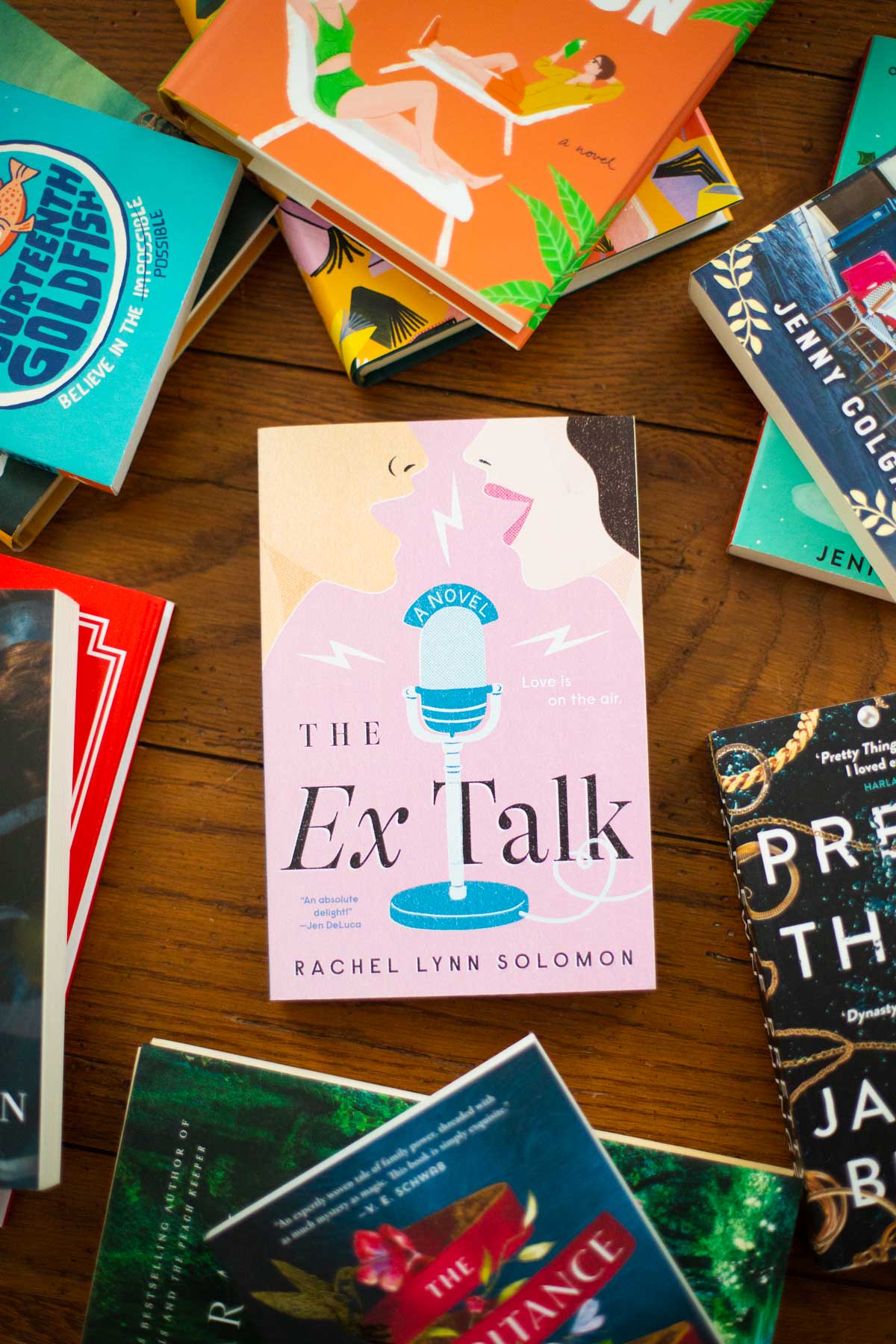 A copy of the book The Ex Talk is on the table.