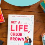 A copy of the book Get a Life Chloe Brown sits on a table.