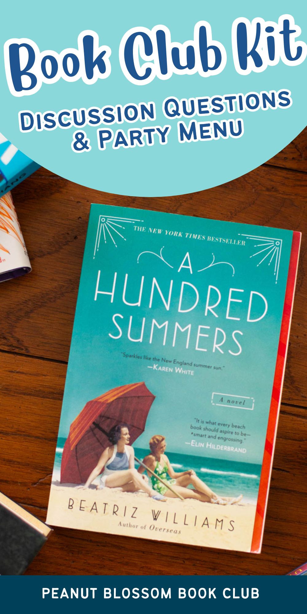 A copy of the book A Hundred Summers sits on a table.