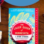 A copy of the book The Lager Queen of Minnesota is on the table.