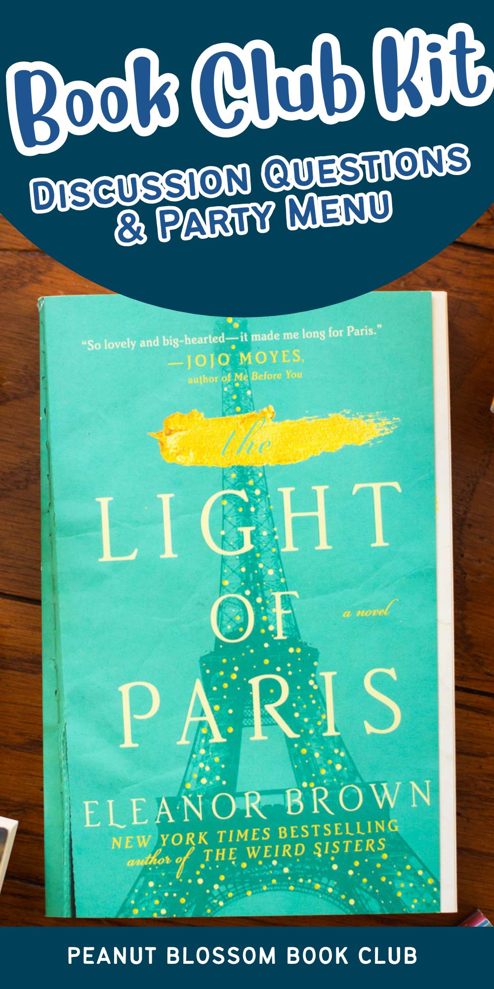 A copy of the book The Light of Paris sits on a table.