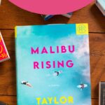 A copy of the book Malibu Rising is on the table.