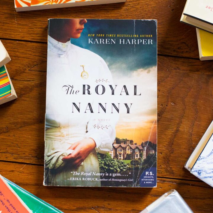 A copy of the book The Royal Nanny sits on the table.