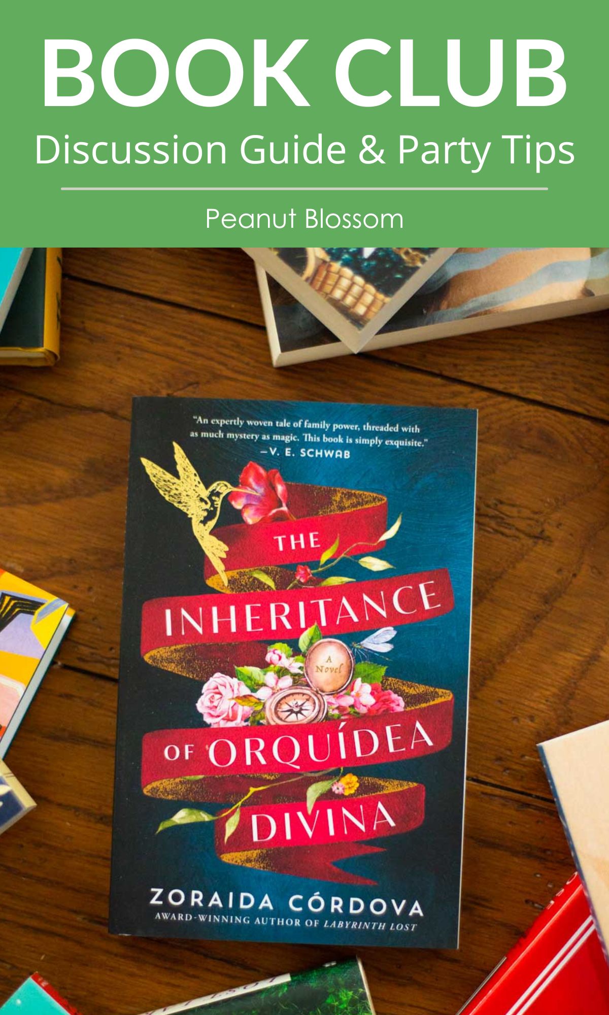 A copy of the book The Inheritance of Orquídea Divina by Zoraida Córdova sits on the table.
