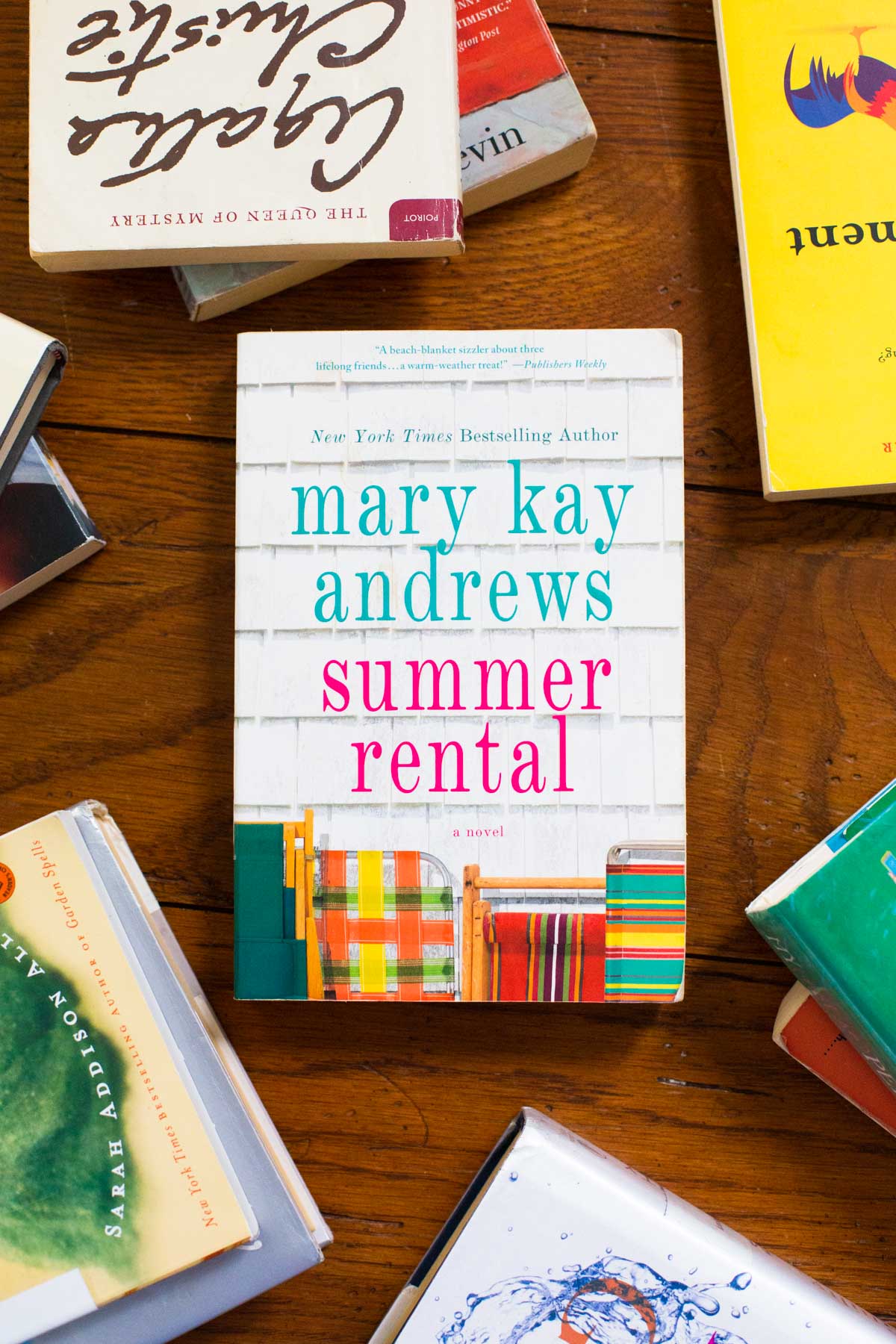 A copy of the book Summer Rental is on a table.