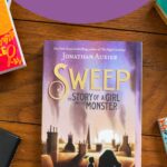 A copy of the book Sweep is on the table.