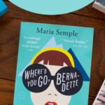 A copy of the book Where'd You Go Bernadette sits on a table.