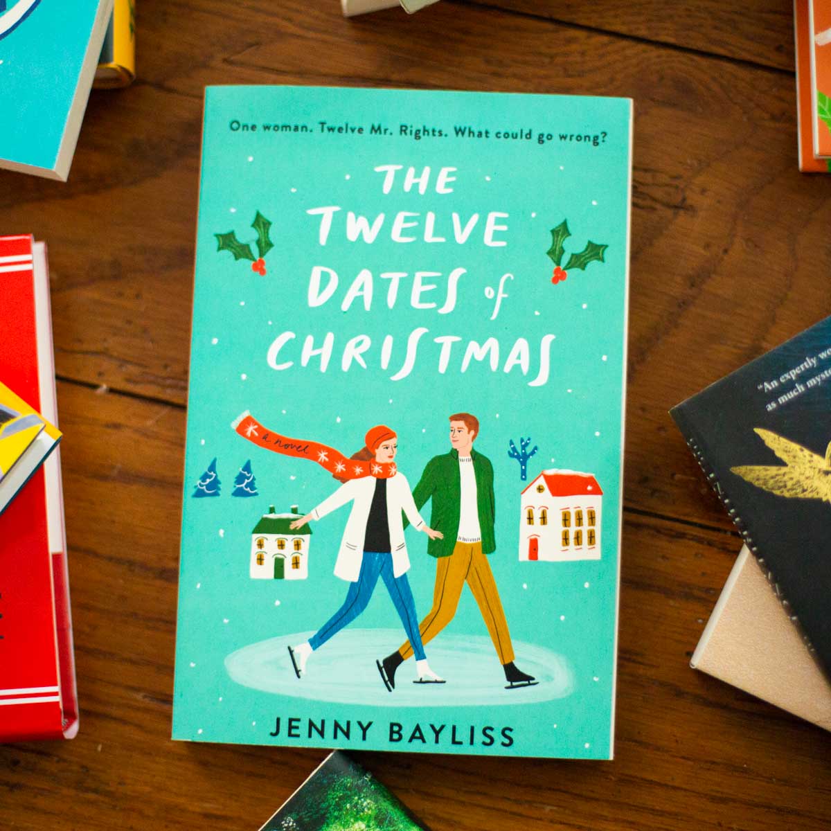 A copy of the book The Twelve Dates of Christmas is on the table.
