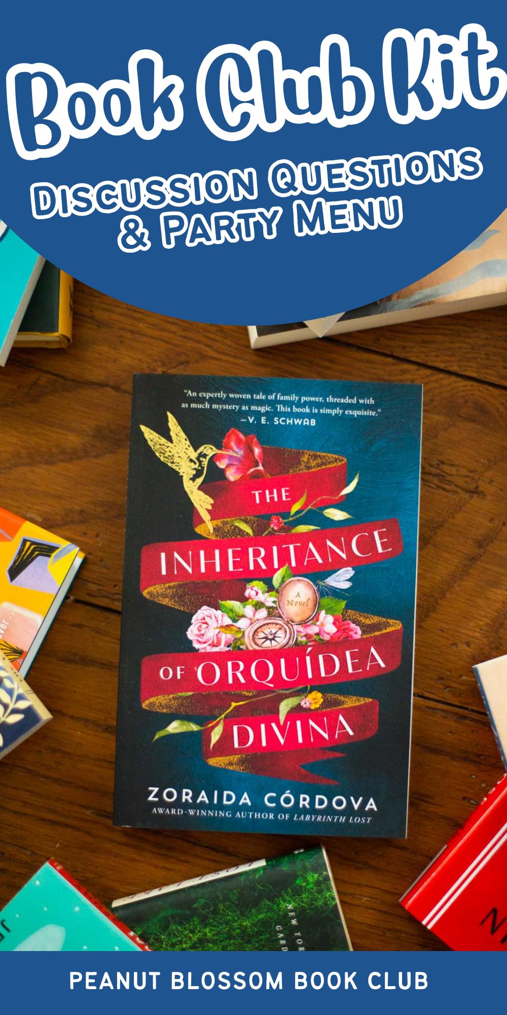 A copy of the book The Inheritance of Orquídea Divina by Zoraida Córdova sits on the table.