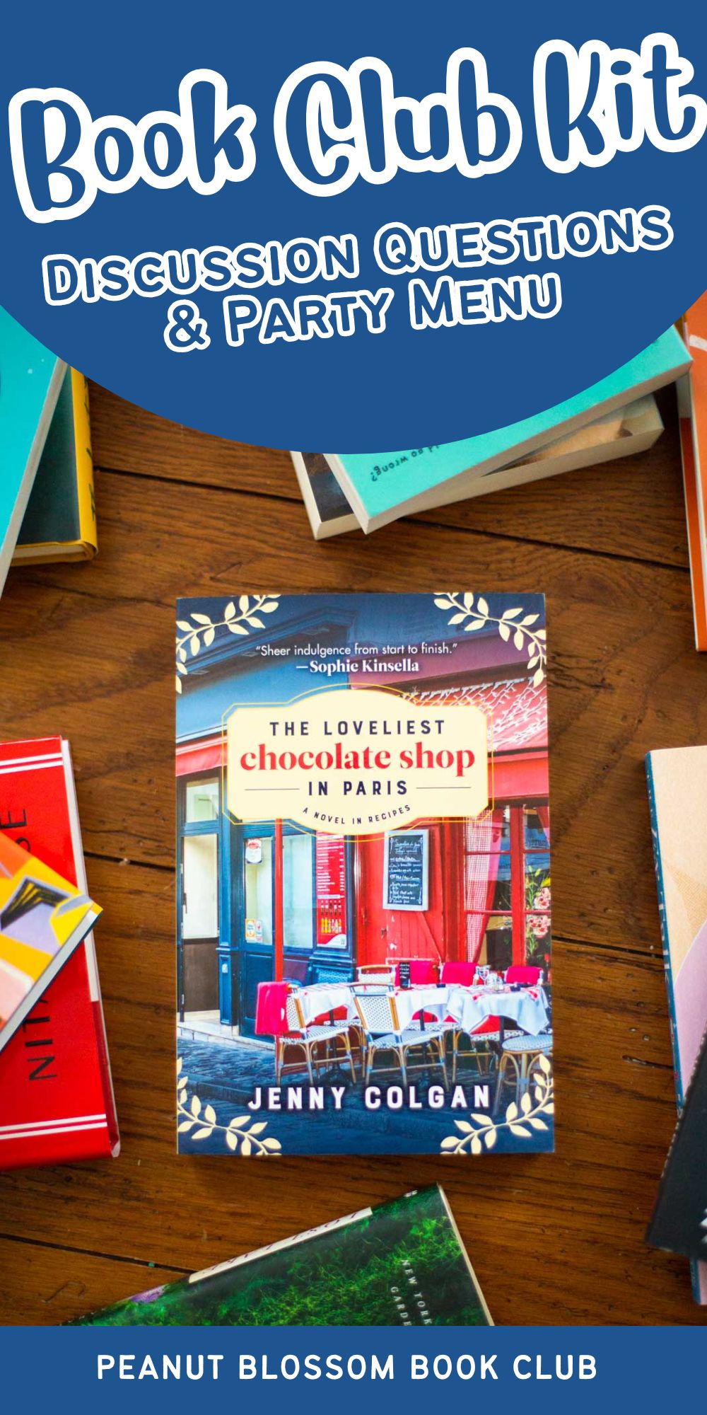 A copy of The Loveliest Chocolate Shop in Paris by Jenny Colgan sits on a table.