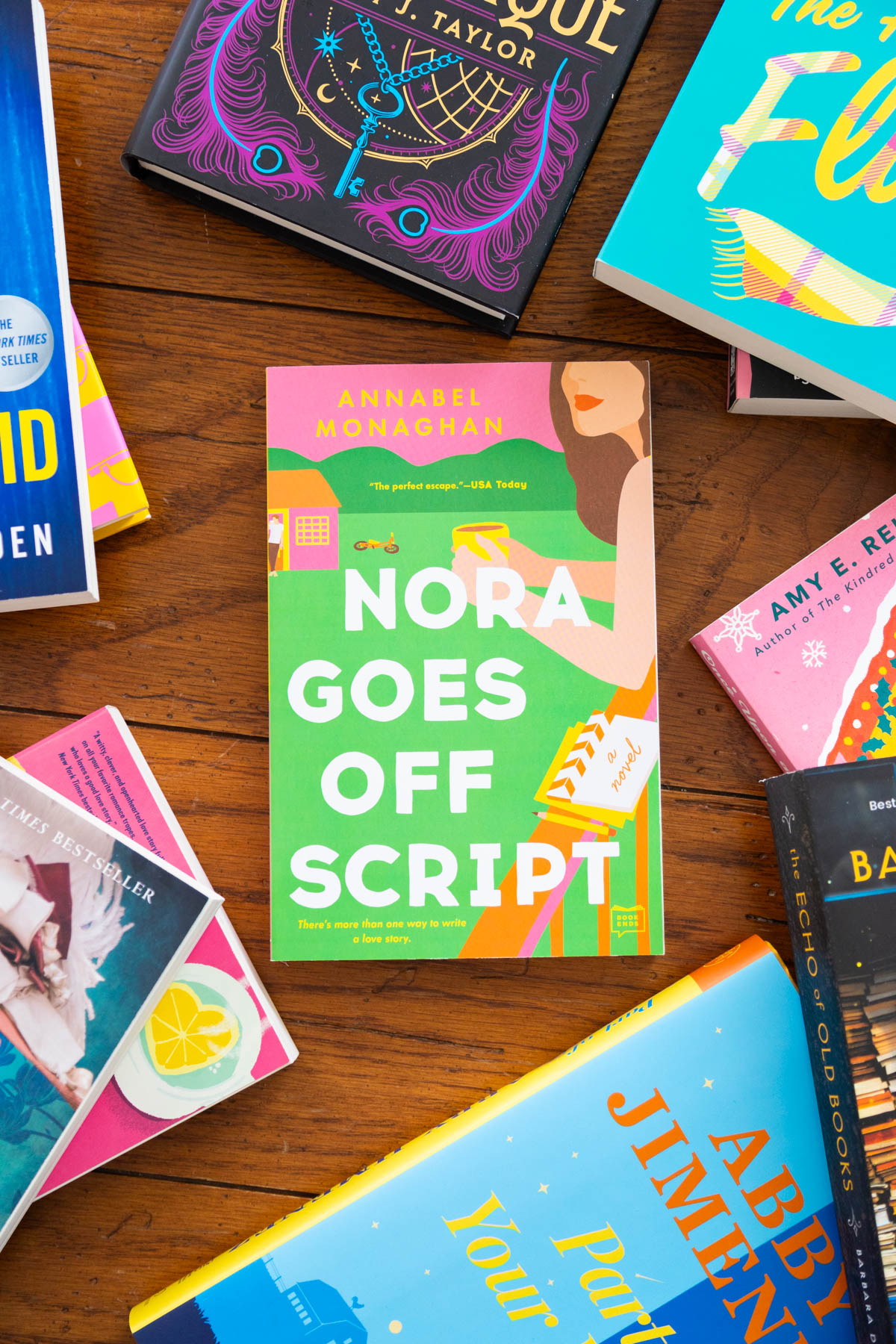 A copy of the book Nora Goes Off Script is on the table.