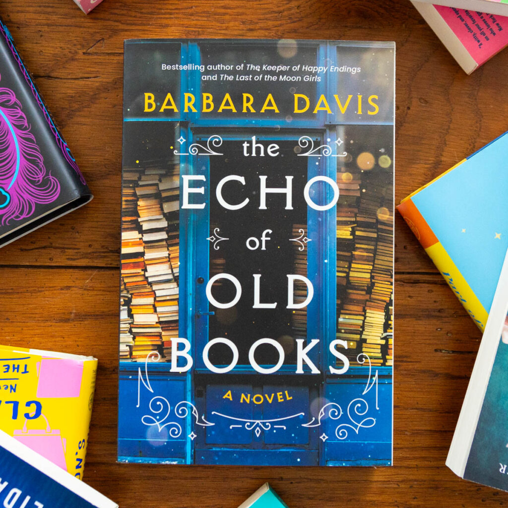 A copy of The Echo of Old Books is on the table.