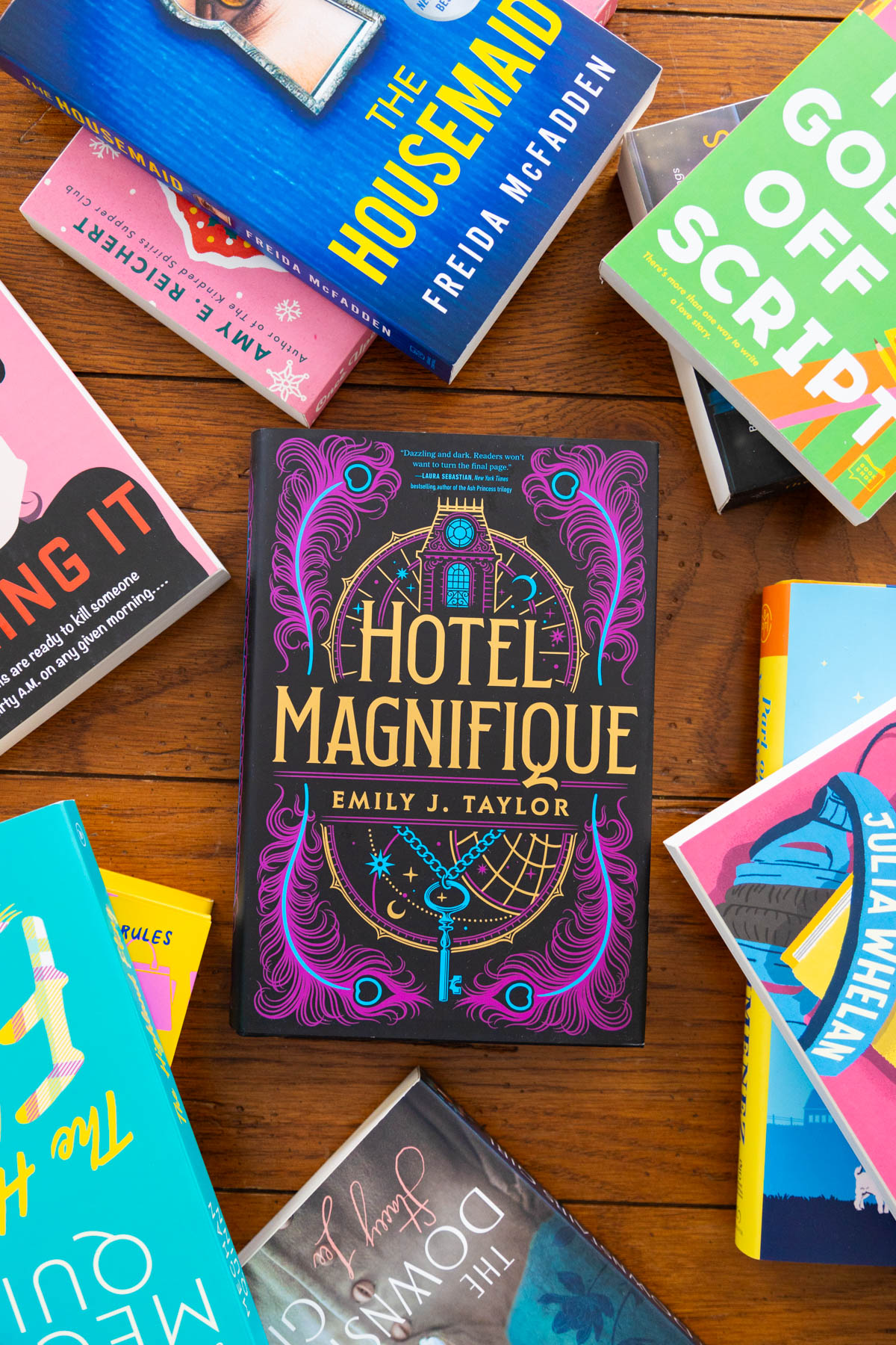 A copy of the book Hotel Magnifique is on the table.