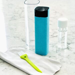 A blue microfiber cleaner with a bottle of cleanser liquid sits next to a small green screen brush and microfiber cloth.