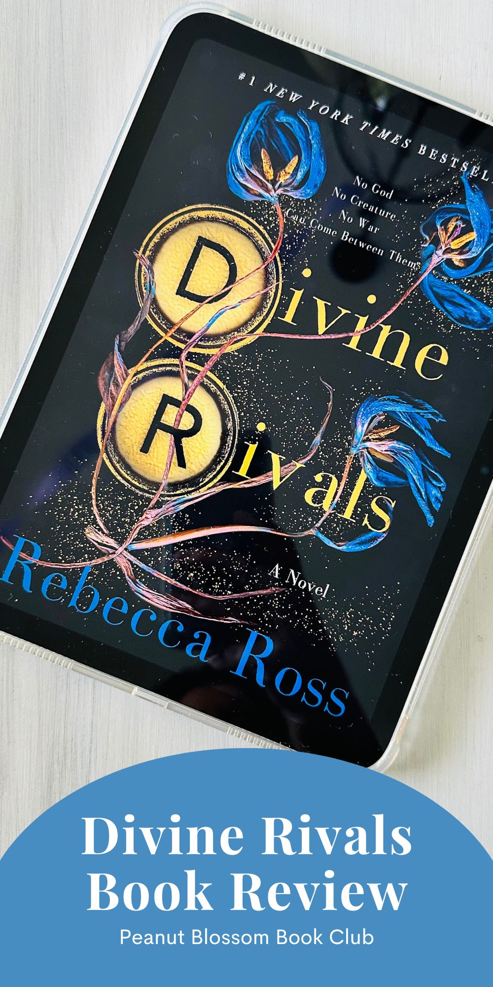 The book cover for Divine Rivals by Rebecca Ross is on the screen of an iPad.