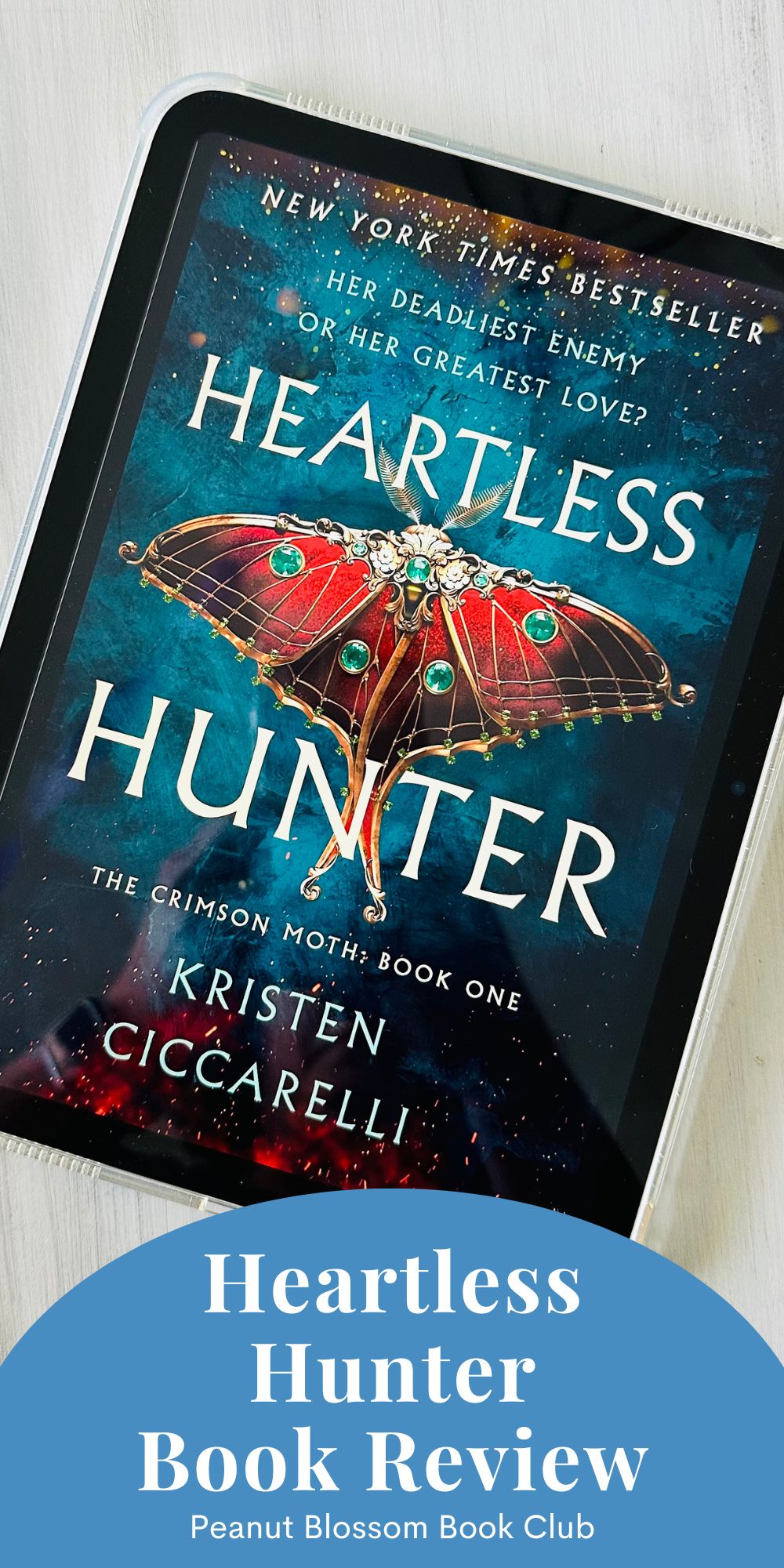 The book cover for Heartless Hunter by Kristen Ciccarelli is on the screen of an iPad.