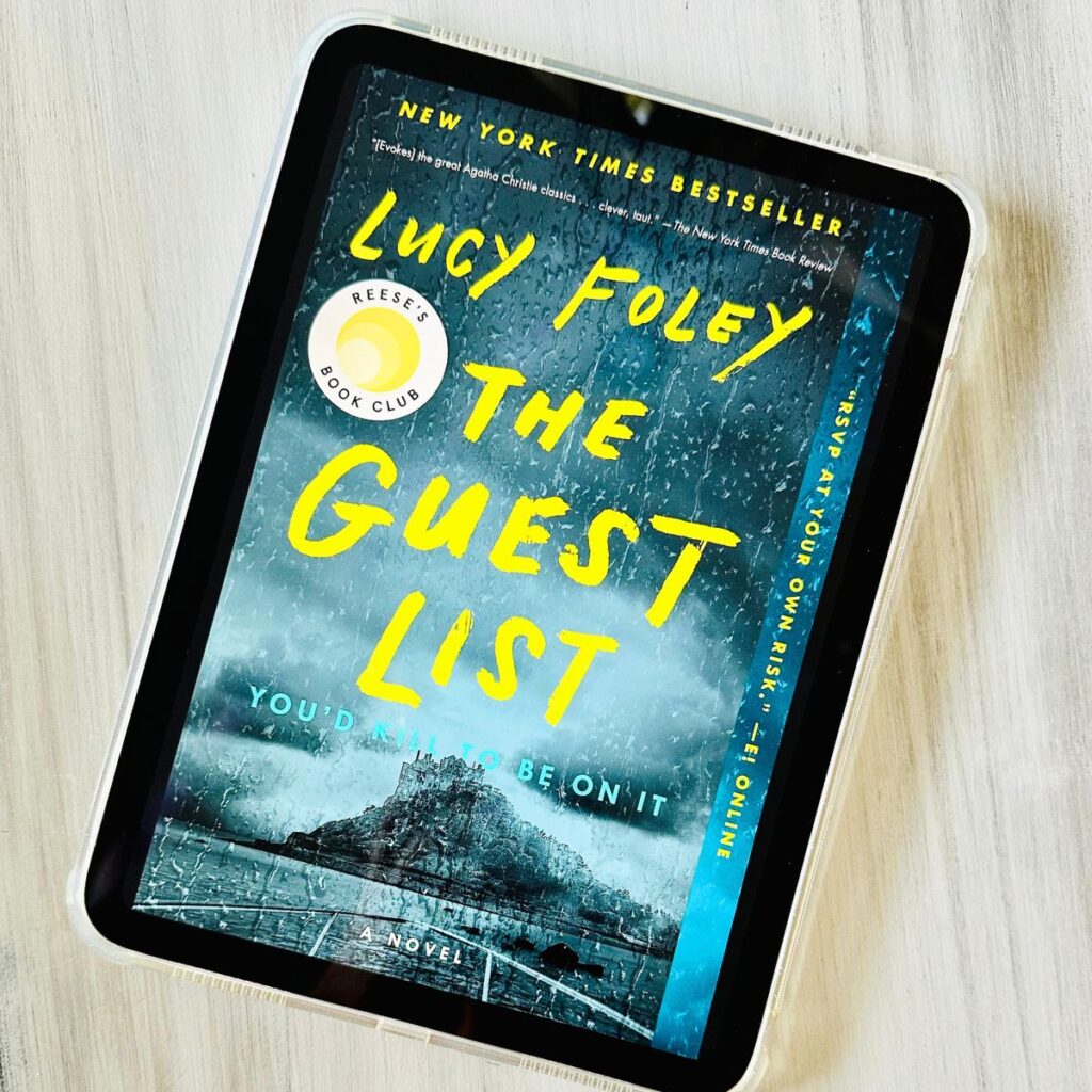 The cover for the book The Guest List by Lucy Foley is on the screen of an ipad.