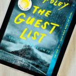 The cover for the book The Guest List by Lucy Foley is on the screen of an ipad.