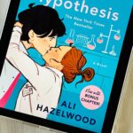 The cover of the book The Love Hypothesis by Ali Hazelwood on the screen of an iPad