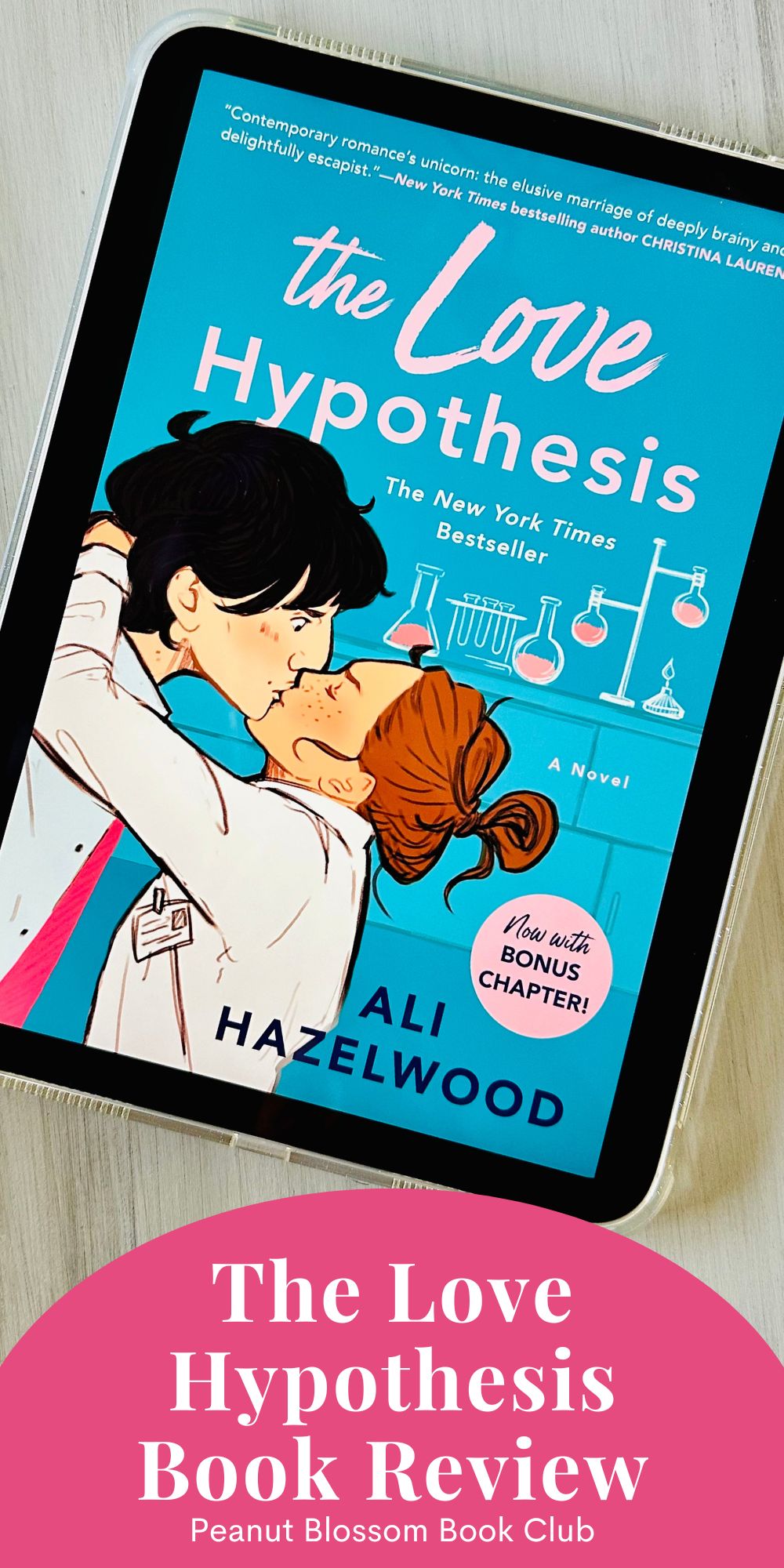 The cover of the book The Love Hypothesis by Ali Hazelwood on the screen of an iPad