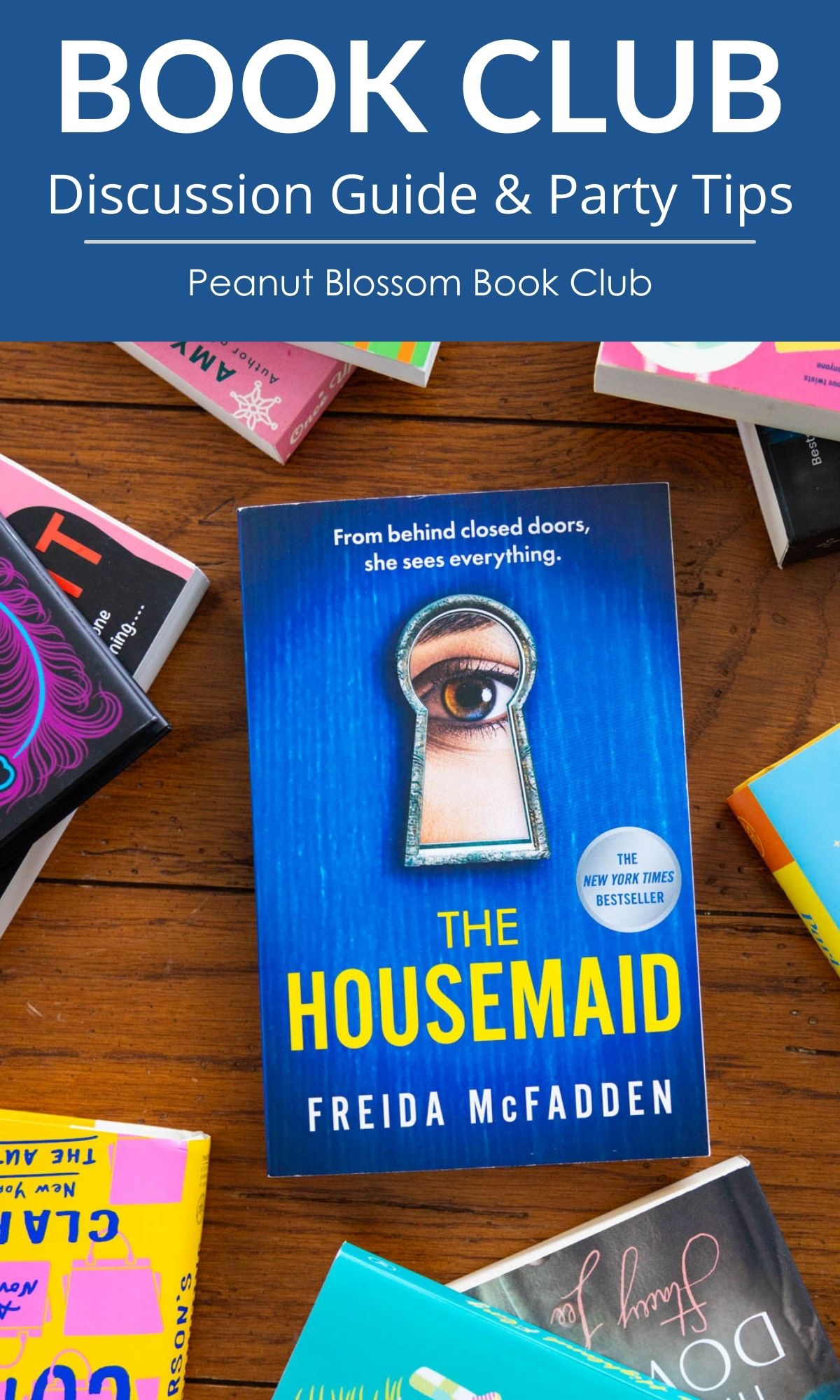 A copy of the book The Housemaid by Freida McFadden is on the table.