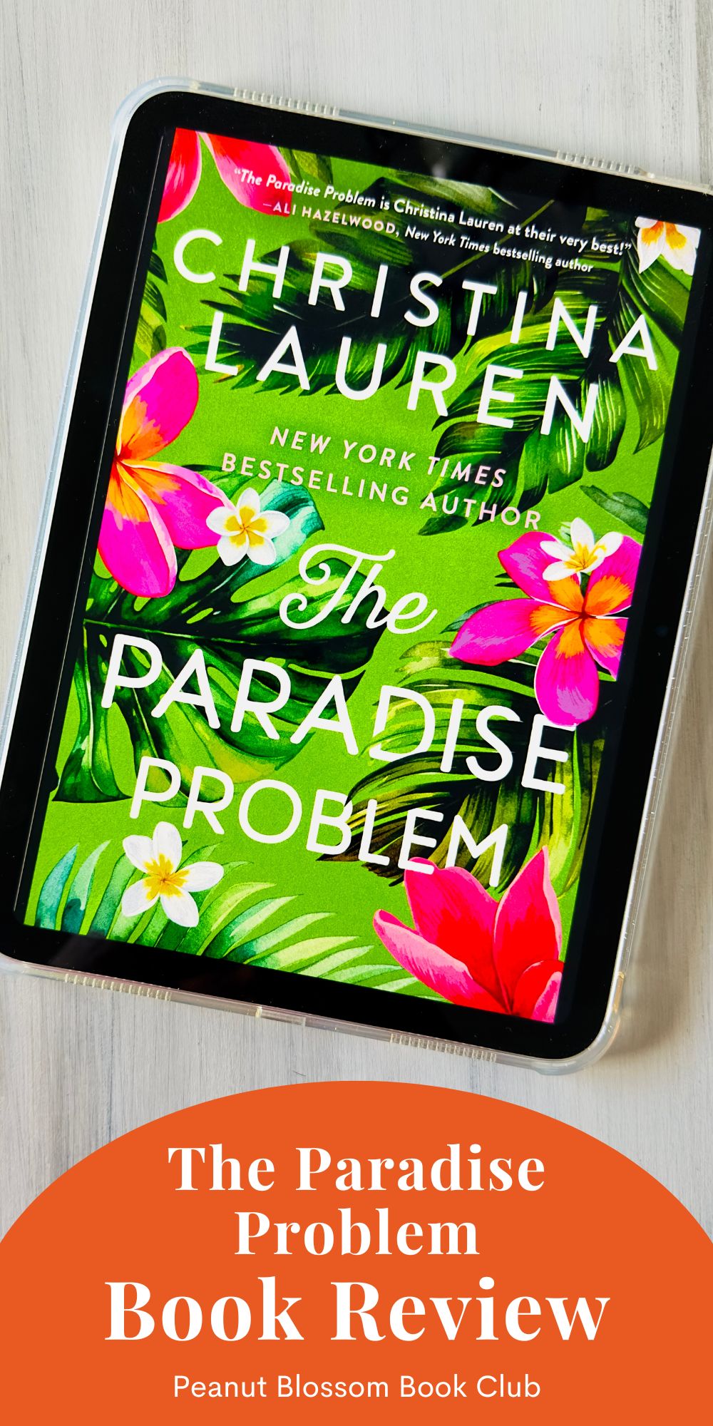 The cover of the book The Paradise Problem by Christina Lauren is on the screen of an Ipad.