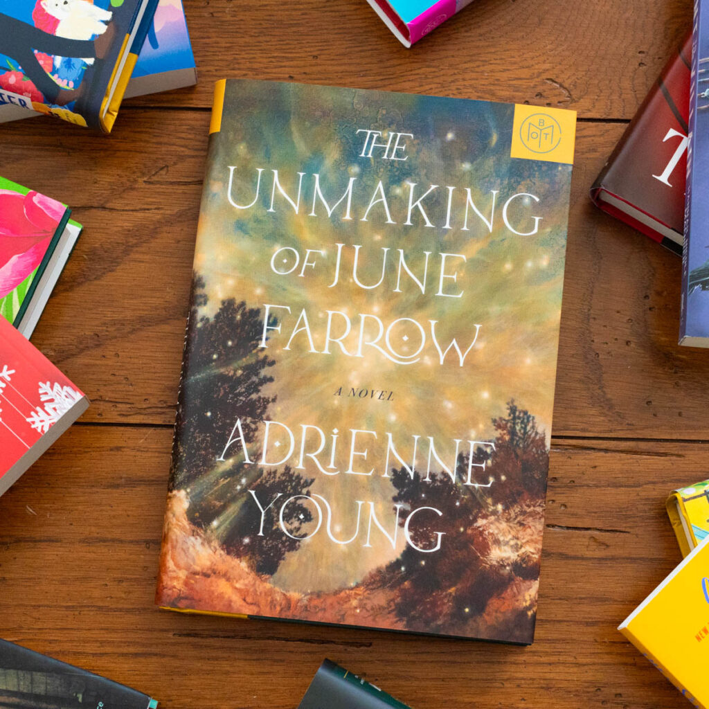 A copy of the book The Unmaking of June Farrow by Adrienne Young sits on the table.