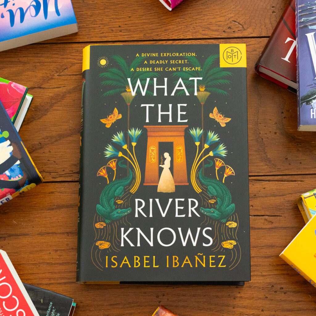 The copy of What the River Knows by Isabel Ibanez sits on the table.