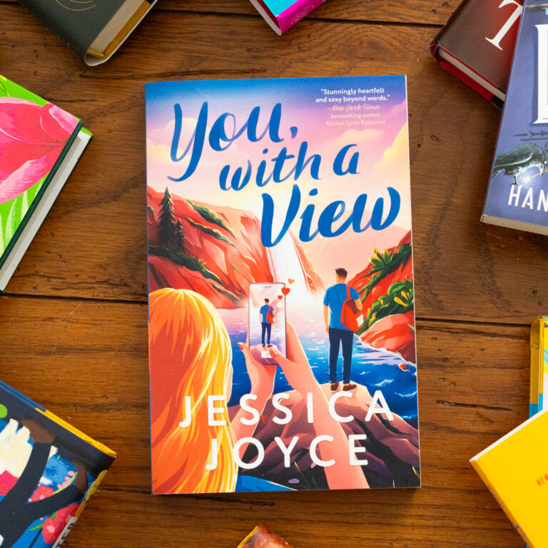 A copy of the book You With a View by Jessica Joyce sits on the table.