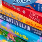 A stack of books is lined up on the table.