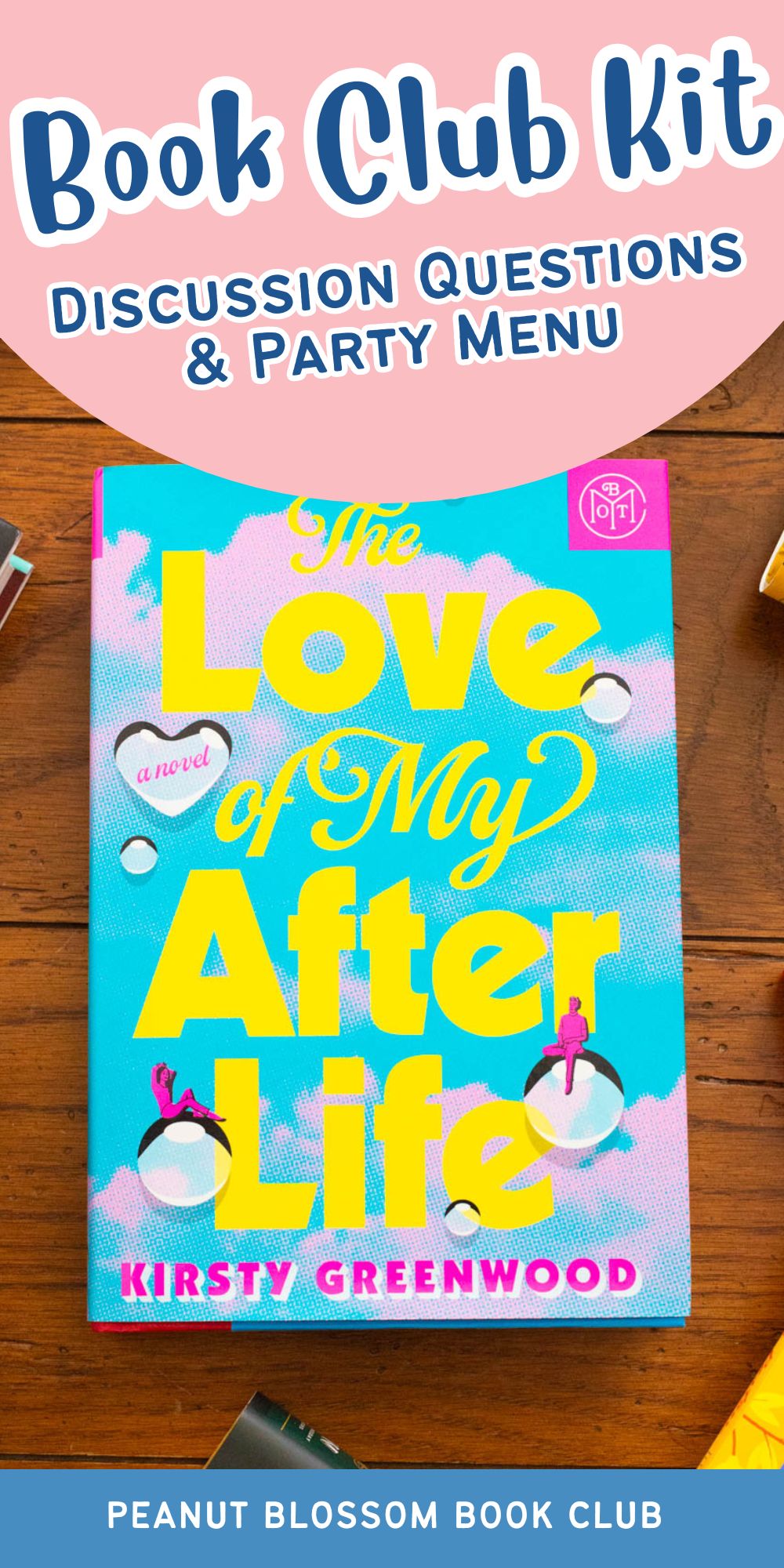 A copy of the book The Love of My After Life by Kirsty Greenwood sits on the table.