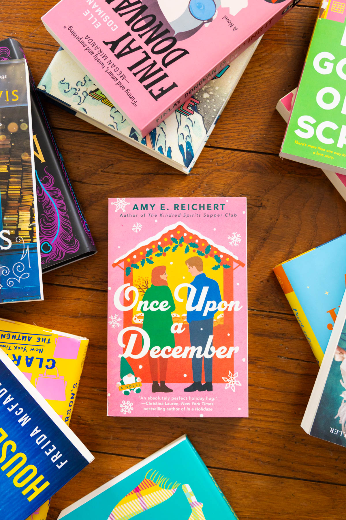 A copy of Once Upon a December by Amy E. Reichert sits on the table.